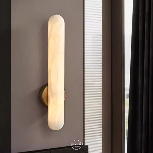 Wall-mounted light fixture on a gray wall with a window in the background, featuring the Lumina Living brand. Singapore's top online destination for stylish and high-quality lighting solutions. Whether you’re looking to transform your home with elegant pendant lights, modern chandeliers, or energy-efficient LED lights, we have an extensive selection to suit every taste and budget.